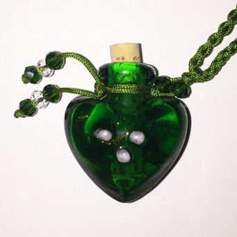 Green Heart Glass Bottle Cremation Pendant that holds ashes